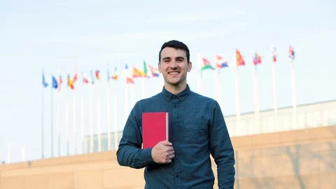 Student guy showing thumb up gesture Stock Footage 105926061
