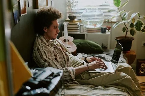 Student Hacker Coding on Bed Stock Photos