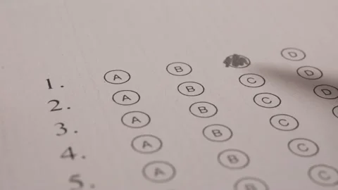 Student Hand Filling Out In Answer Sheet Using Pencil. Close Up Stock Footage 172586186