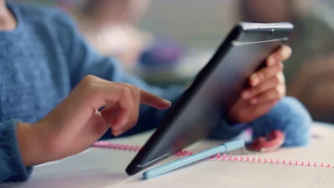 Student hand using digital tablet. Girl doing class work on tablet computer Stock Footage 154947691