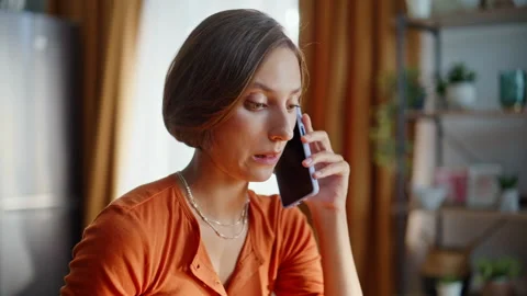 Student hand using touchpad laptop talking mobile phone in apartment closeup. Stock Footage 333775993