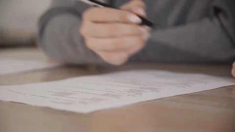Student hand writing exam test close up of desk modern lectures university 4K. Stock Footage 120052346