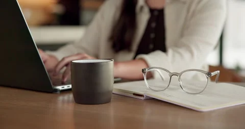 Student, hands and typing in home with laptop, glasses and notebook for distance Stock Footage 336657456
