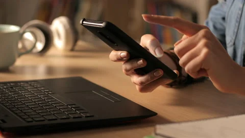Student hands using smart phone at home in the night Stock Footage 127993474