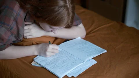 Student handwritten math equations, doing homework at home Stock Footage 342237555