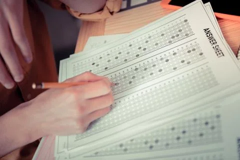 Student having a big test with closed-coded answers Stock Photos