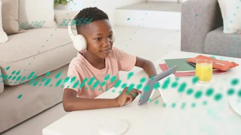 Student headphones tapping tablet causing teal waveform passing expanding then Video stock 333975655