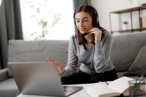Student in headset using laptop Stock Photos