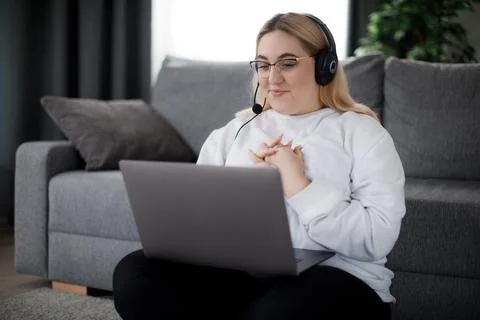 Student in headset using laptop Stock Photos