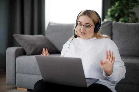 Student in headset using laptop Stock Photos