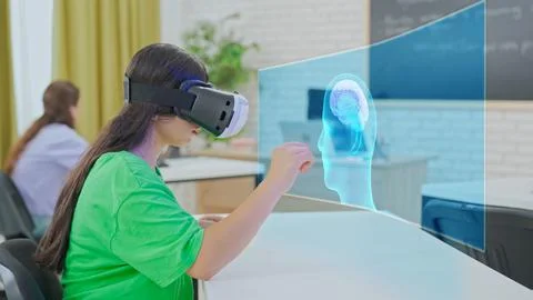 Student Interacting with 3D Brain Model Using VR in Classroom Stock Photos