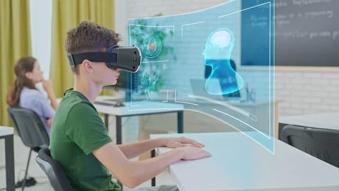 Student Interacting with 3D Brain Model Using VR in Classroom Stock Photos