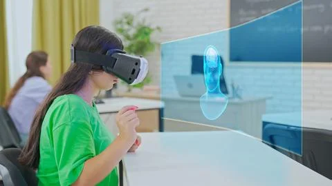 Student Interacting with 3D Brain Model Using VR in Classroom Stock Photos