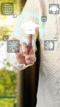 A student interacting with a futuristic digital interface featuring educati.. Stock Photos