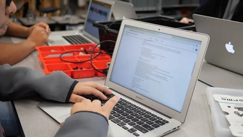 Student On Laptop Scrolling Through Classwork Webpage Stock Footage 126485774