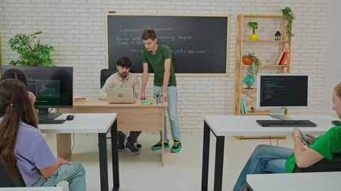 Student Leading a Discussion on Python Programming in Classroom Stock Footage 281073038