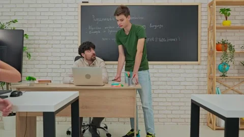 Student Leading a Discussion on Python Programming in Classroom Stock Footage 281073201