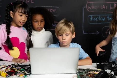 Student learn about coding robotics car in STEM class with attention. Erudition. Stock Photos