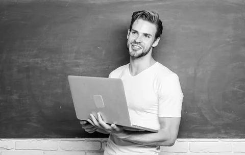 Student learn digital world. School teacher with laptop. Handsome man use modern Stock Photos