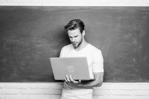 Student learn programming language. School teacher programming with laptop Stock Photos