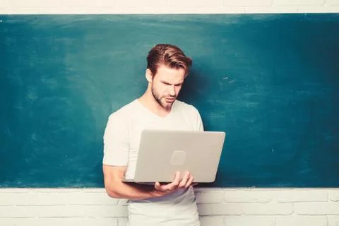 Student learn programming language. School teacher programming with laptop Foto stock