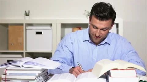 Student learning and holding thumb up Stock Footage 11019662