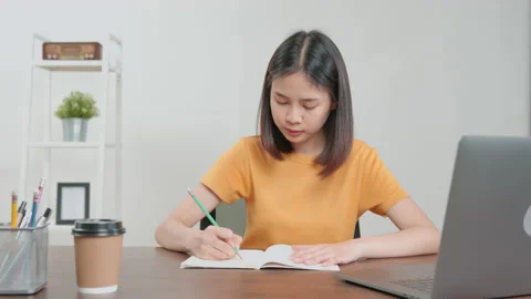 Student learning by online lesson at home and chatting on laptop with teacher. 스톡 동영상 138786836