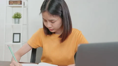 Student learning by online lesson at home and chatting on laptop with teacher. 스톡 동영상 138786871