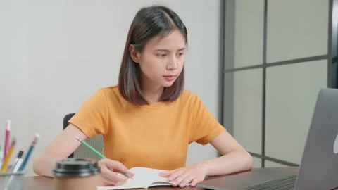 Student learning by online lesson at home and chatting on laptop with teacher. 스톡 동영상 138786900