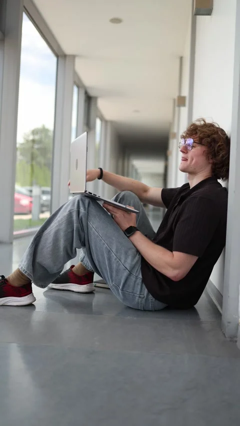 Student learns anywhere using laptop with focus and determination Stock Footage 337850498