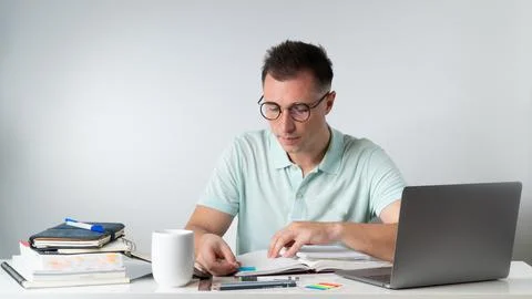The student learns - makes notes in the notebook Stock Photos