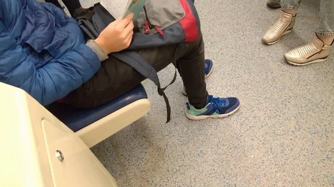 Student learns summary while riding in the subway 스톡 동영상 100459836