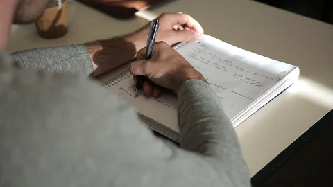 Student at lecture Taking Notes 库存影片 89802699