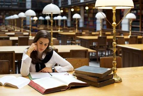 Student in library reading Stock Photos