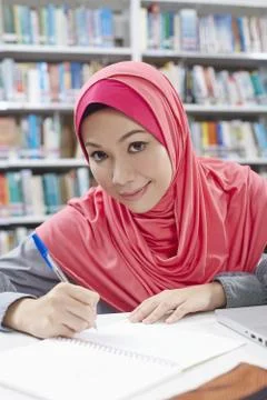 A student in library studying Stock Photos