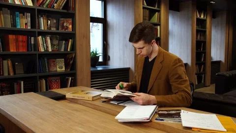 Student in the library studying the subject Stock Footage 155962991