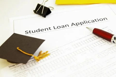 Student loan application form and mini graduation cap Stock Photos