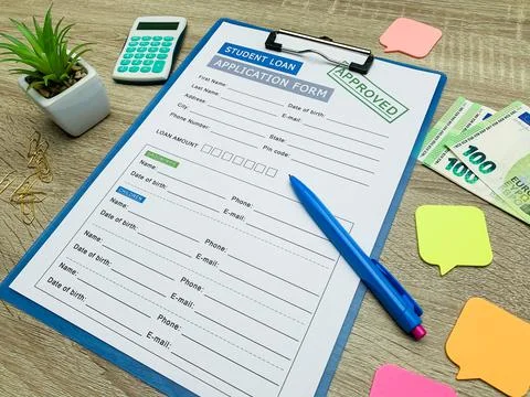 Student loan application form document on table Stock Photos