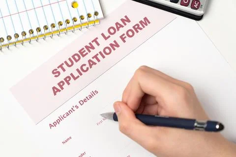 Student Loan Application Form on Laptop Keyboard Stock Photos