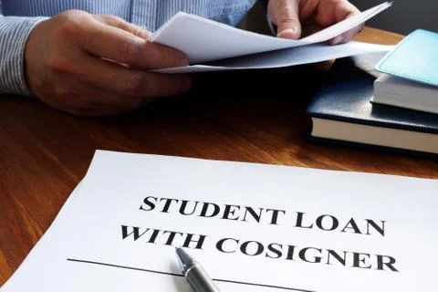 Student loans with cosigner application form and pen. Stock Photos