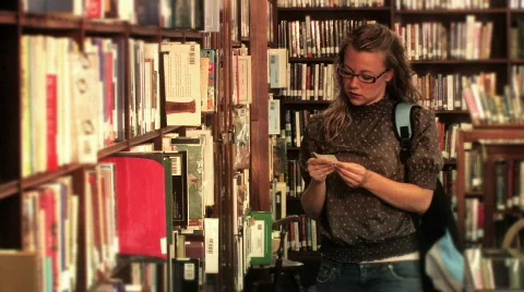 Student Locates a Book 778 Stock Footage