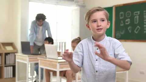 Student looking and waving hands while friend studying about code. Pedagogy. Stock Footage 274305146