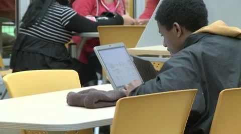 Student looking at computer in classroom (2 of 5) Stock Footage 8979972