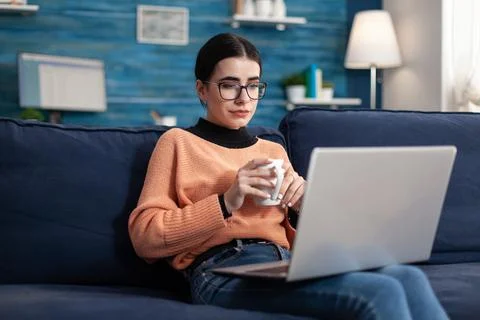 Student looking at laptop computer during online management courses Stockfoto's