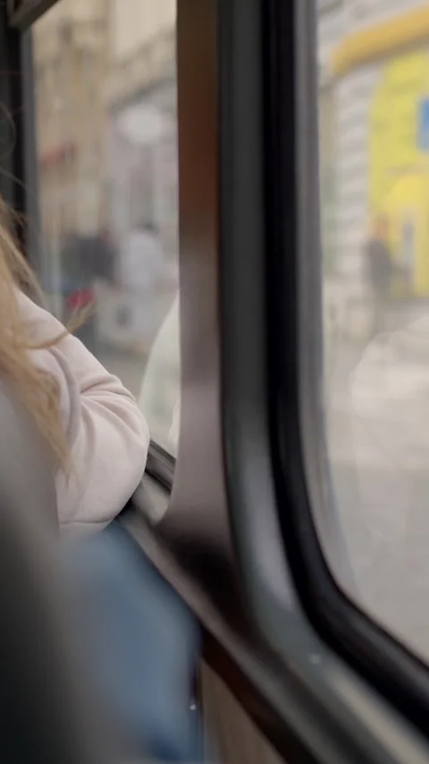 Student looking out bus window on graduation day in Czech Видео 347204453
