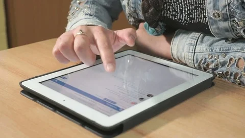 Student looking at photos using computer tablet Stock Footage 82956756