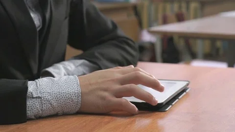 Student looking at photos using computer tablet Stock Footage 84239600