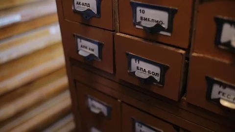 Student looking for the right book in the old style USSR library catalog. Close  Stock Footage 83585596
