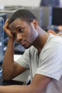 Student looking upset in computer room Stock Photos