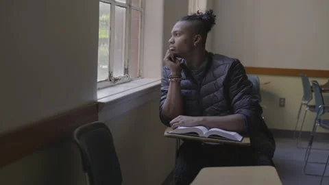 Student Looks Out Window In Deep Thought Stock Footage 208718636